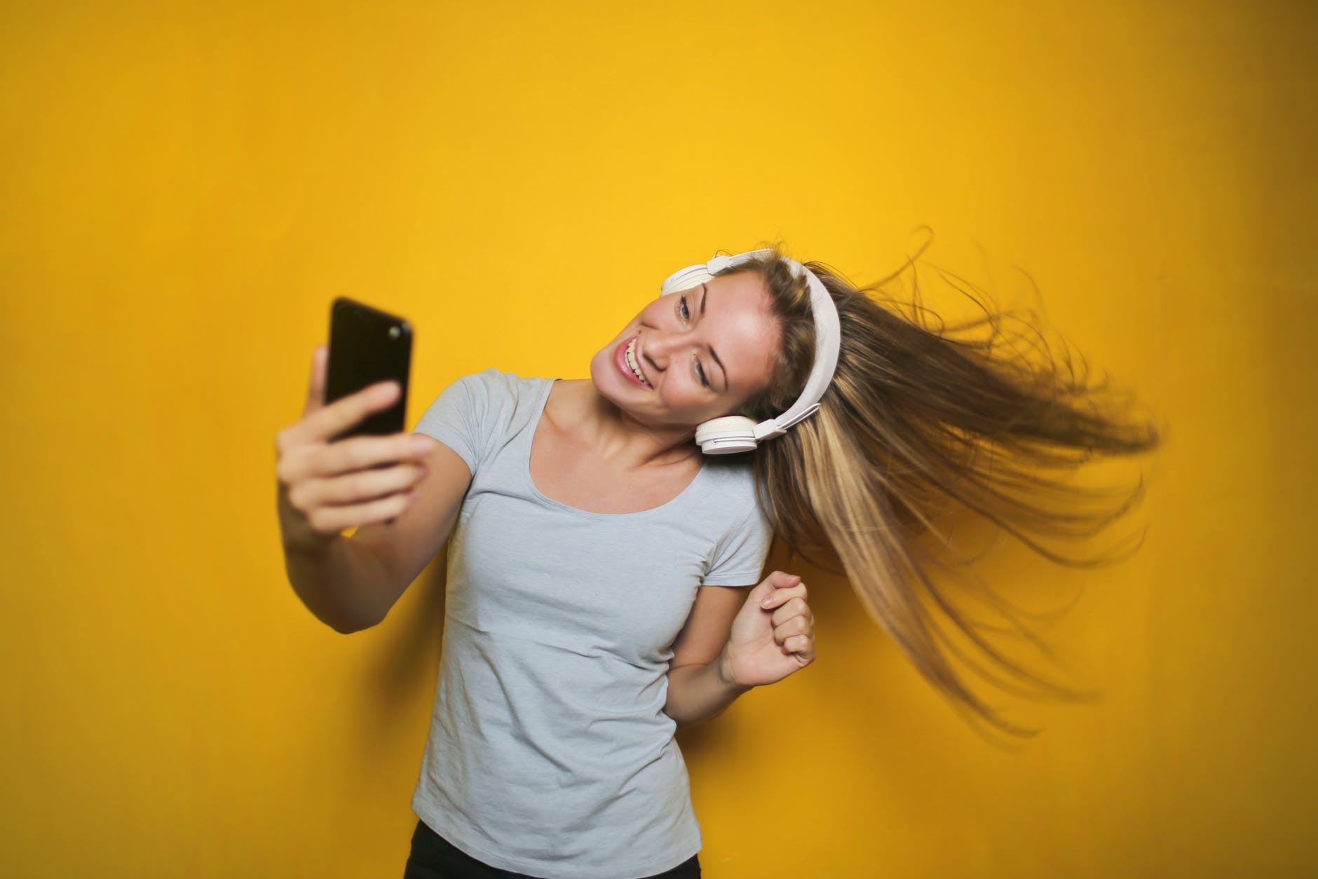 photography of a woman listening to music