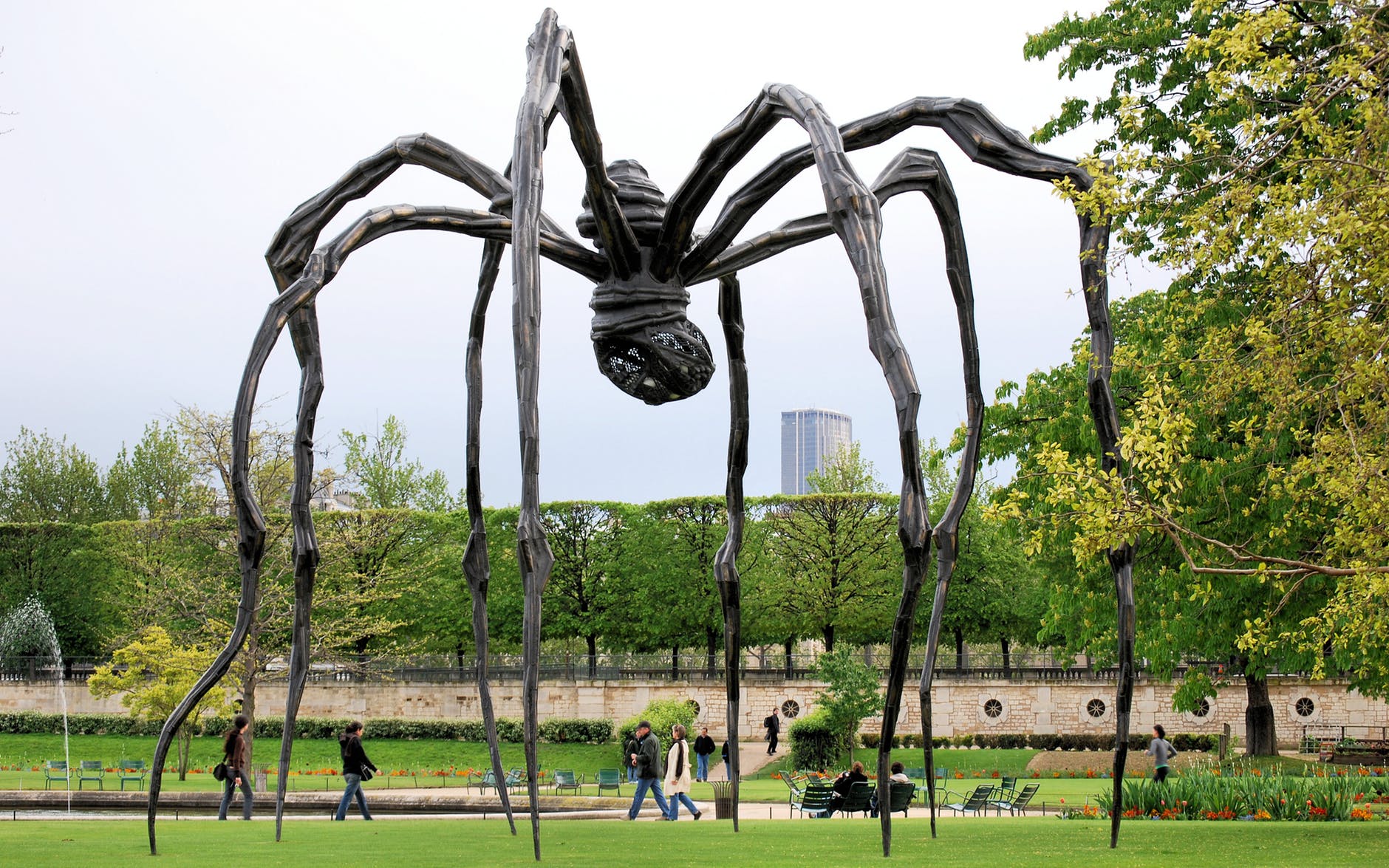 brown wooden spider formed statue photography