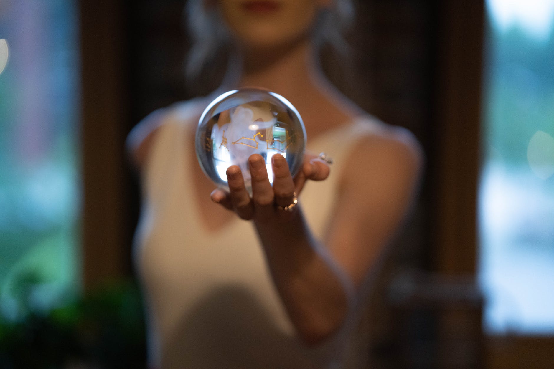 woman holding glass ball