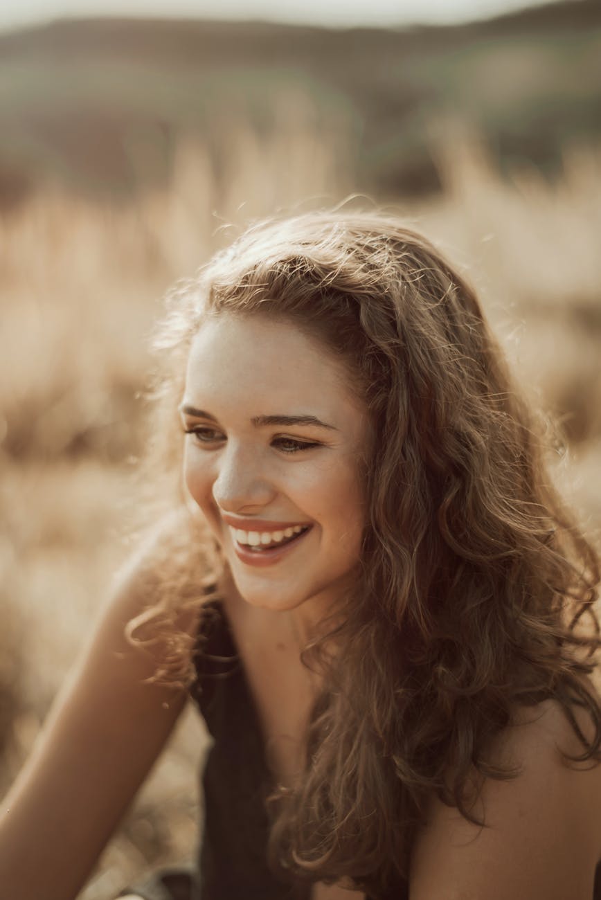 smiling woman while sitting