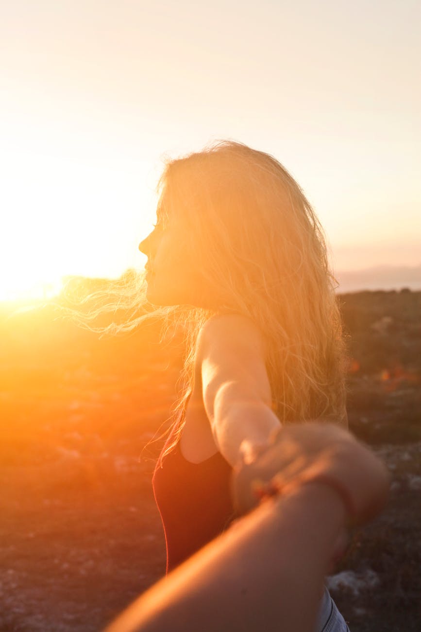 photo of a woman at sunset