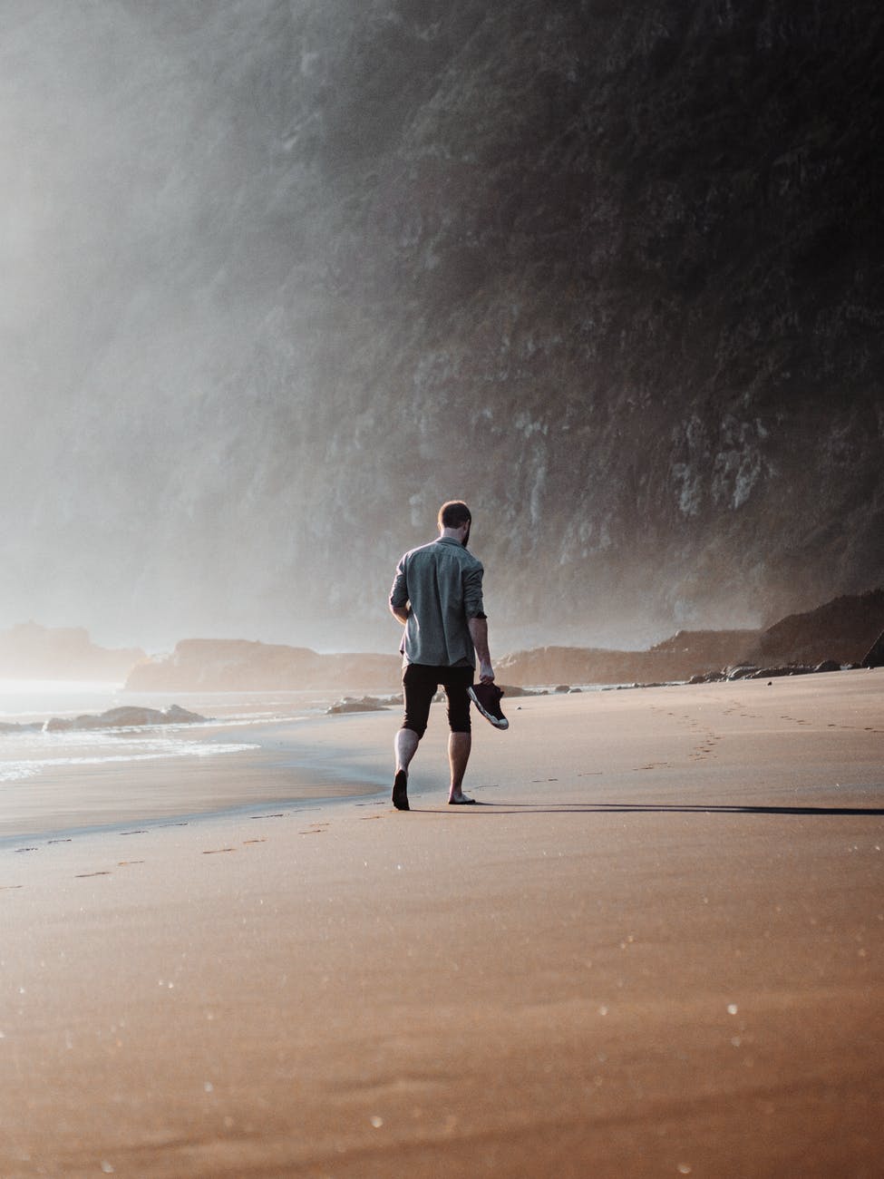 man walking on beach