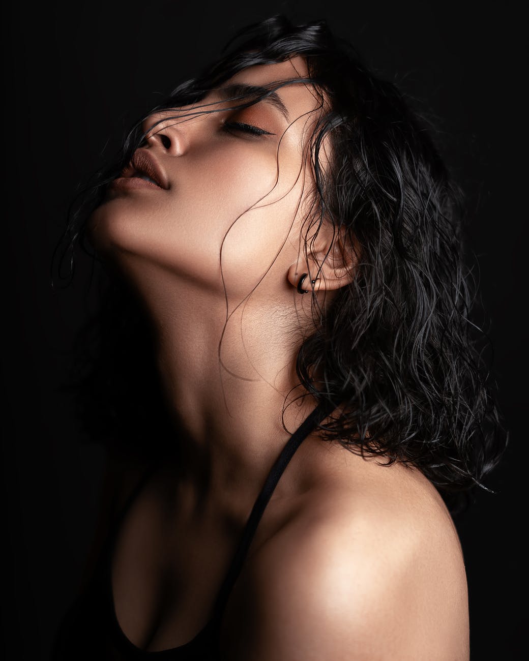 photo of woman closing her eyes